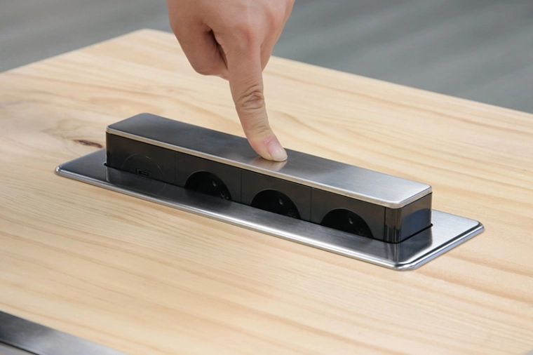 Retractable mechanism for a clean work surface look