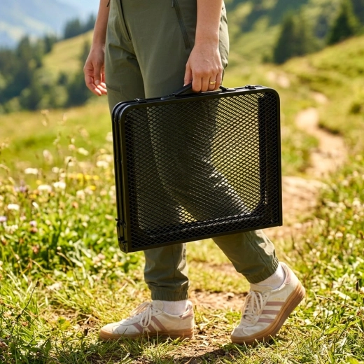 Folds into a compact suitcase with a handle