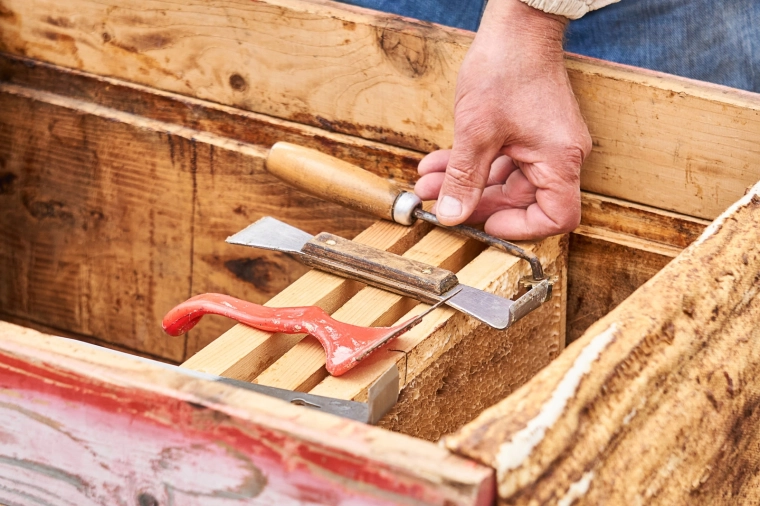 Hook and scraper for easy prying and cleaning