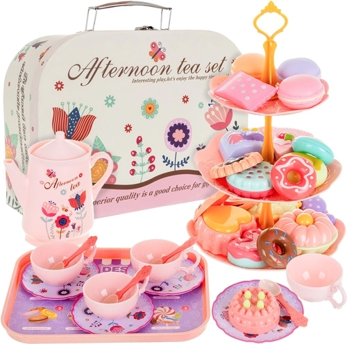 Children’s tea set in a suitcase with cakes and pastries