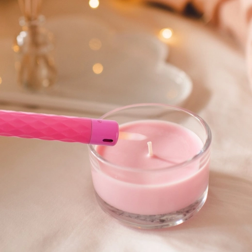 Extended nozzle for comfortable candle lighting