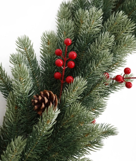 Realistic festive look with berries and pine cones