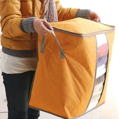 Compact orange cover for storage box for bedding